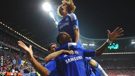 Didier Drogba and team-mates celebrate the Ivorian's equaliser