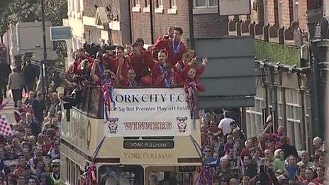 York City players on their open-top bus