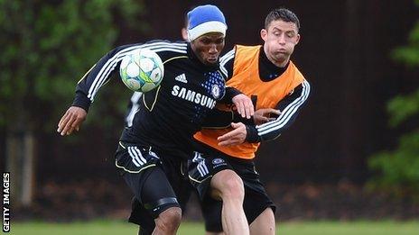 Gary Cahill (right) takes on Didier Drogba in training