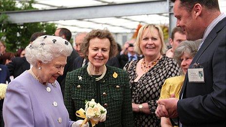 The Queen is presented with posy of Queen's Jubilee Roses by Richard Beales, MD of Peter Beales Roses