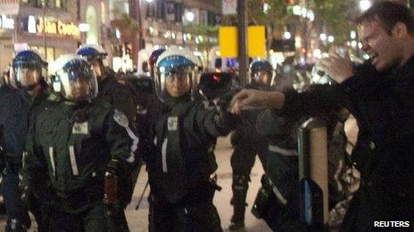 Police use pepper spray on a protester in Montreal on 22 May 2012
