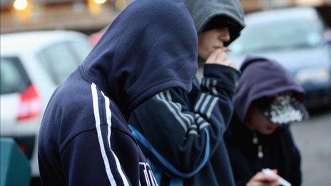 Young persons in hooded tops