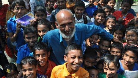 Joynal Abedin with school children