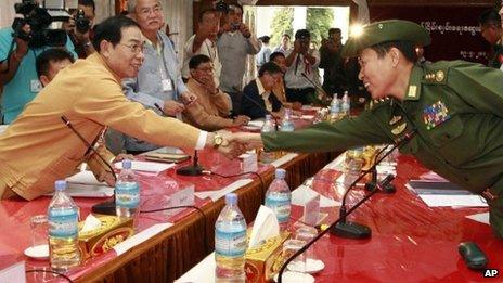 Shan State Army leader Yawd Suk (left) shakes hand with General Soe Win from the Burmese Army.