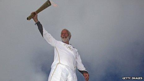 Sir Chris Bonington with the torch on Snowdon