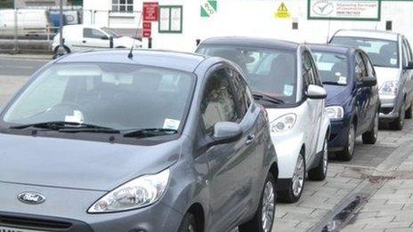 Cars parked on the pavement in Portland Street, Aberystwyth