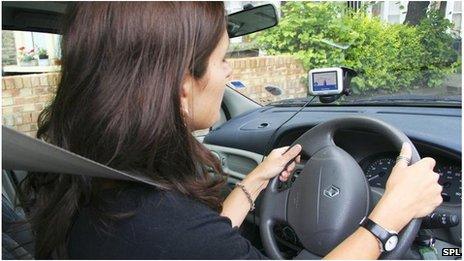 A woman driving a car