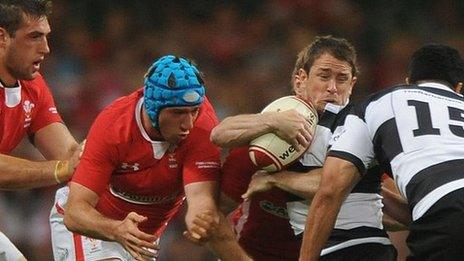 Shane Williams is tackled