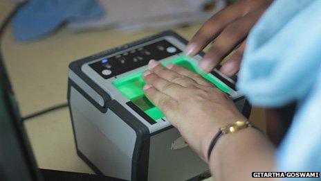 Fingerprints being taken at a biometric identity number centre in India