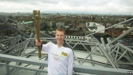 Hurling player Henry Shefflin carried the torch atop Croke Park