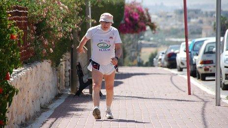 Shaul Ladany taking part in a 76km walk to mark his 76th birthday, in the town of Omer, near Be'er Sheba