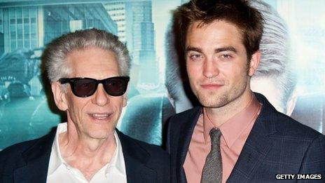 Robert Pattinson (R) and David Cronenberg pose during the Cosmopolis premiere at Le Grand Rex on 30 May in Paris