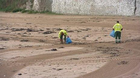 Beach cleaners on a beach in Thanet