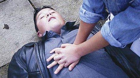 Woman giving CPR