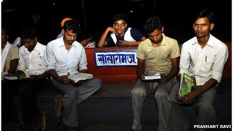 Men studying on the railway station in Sasaram