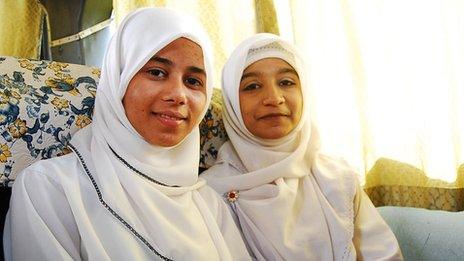 Sharifah binti Hussein (L), with a friend