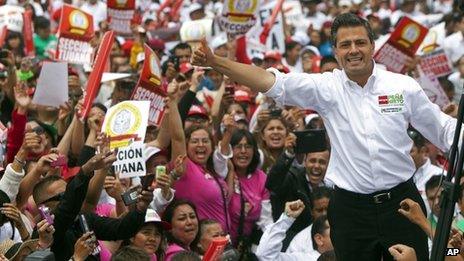 Mexican presidential candidate Enrique Pena Nieto of the Revolutionary Institutional Party (PRI) waves to the crowds during a campaign stop in the northern border city of Tijuana, Mexico, 3 June