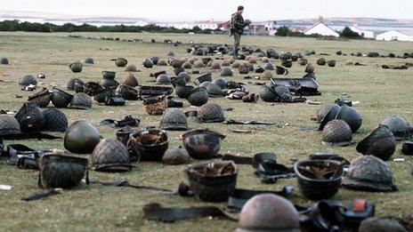 Argentinian helmets on ground after battle for Goose Green