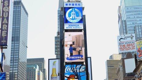 A new electronic billboard leased by Xinhua (2nd from top), the news agency operated by the Chinese government, makes its debut August 1, 2011 in New York's Times Square.