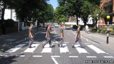 Man walking across Abbey Road