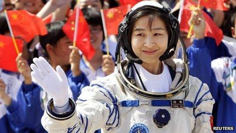 Liu Yang waves during a departure ceremony at Jiuquan Satellite Launch Center, Gansu province, June 16, 2012