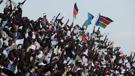 South Sudan football fans waving flags