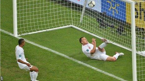 England defender John Terry clears from behind the line against Ukraine