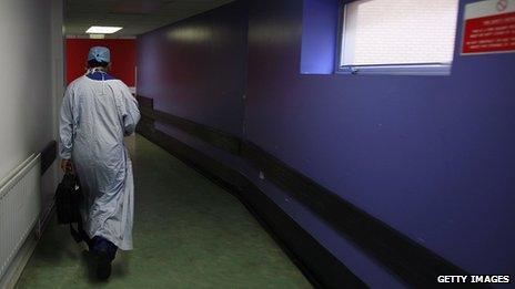 A doctor walking down a corridor