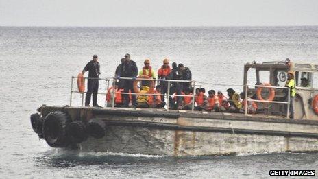 A barge carrying rescued suspected asylum seekers nears Christmas Island on 22 June