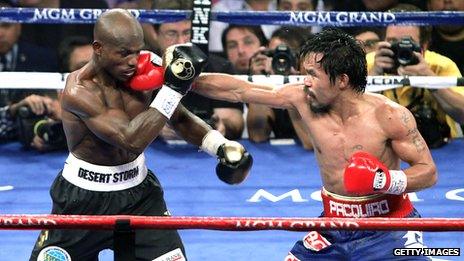 Manny Pacquiao punches Timothy Bradley