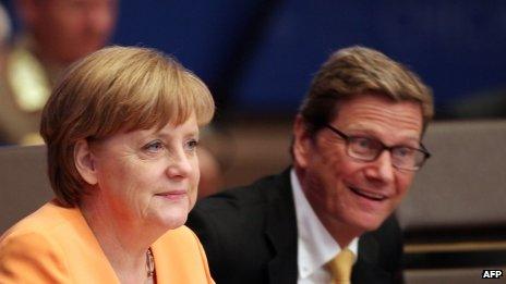 Chancellor Angela Merkel and German foreign Minister Guido Westerwelle at a Nato conference in Chicago in May 2012