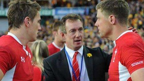 Rob Howley consoles Rhys Priestland and Jonathan Davies