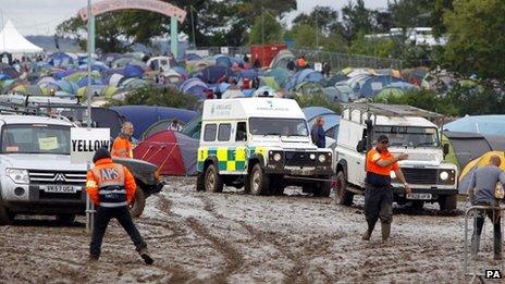 Ambulance being towed through the mud at the Isle of Wight Festival