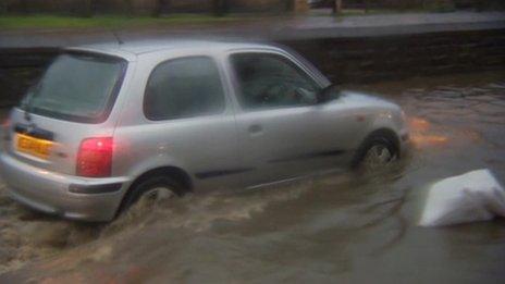 Car driving through flood water