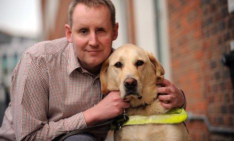 Damon Rose with his guide dog Beckett