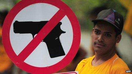 A file image of a man protesting against insecurity and violence in the Venezuelan capital, in Caracas, on 26 August 2010