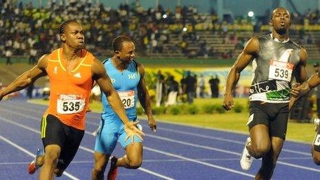 Yohan Blake (left) celebrates after crossing the finish line ahead of current world-record holder Usain Bolt (right)