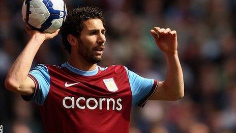 Carlos Cuellar takes a throw in for Aston Villa