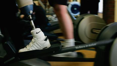 An injured solder with a prosthetic leg uses the gym at Headley Court