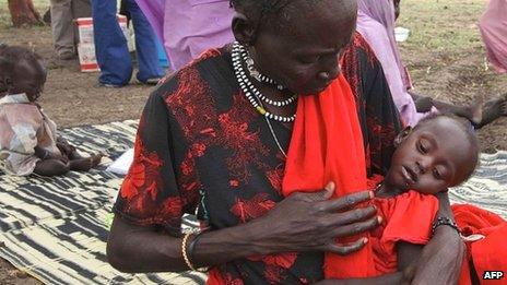 This photo taken on 15 June 2012 at the Jamam refugee camp shows Anima Hassan Omer cradling her granddaughter Khalifa at a Medecins Sans Frontieres (MSF) field hospital in South Sudan's Upper Nile state