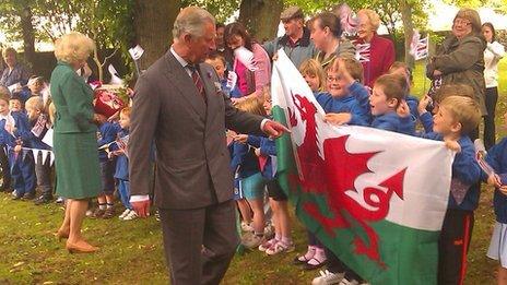 Prince Charles was greeted by school children