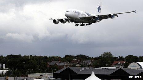 An Airbus A380 lands after performing a display flight at the Farnborough Airshow 2012