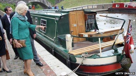 Camilla, Duchess of Cornwall walks along the towpath of the Monmouthshire and Brecon Canal