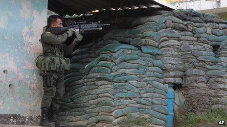 Police guarding the police station in Toribio, Cauca province