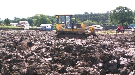 Diggers pulled vehicles out of the mud at the Great Yorkshire Showground in 2012