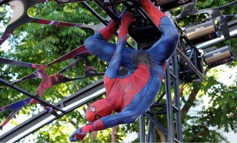 A costumed actor performs at The Amazing Spider-Man's Los Angeles premiere