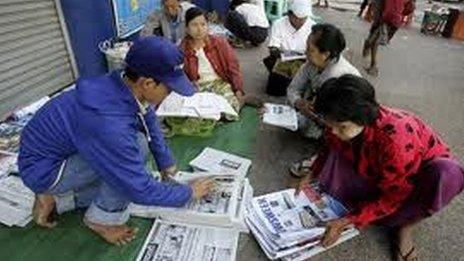 Newspaper sellers in Rangoon, Burma