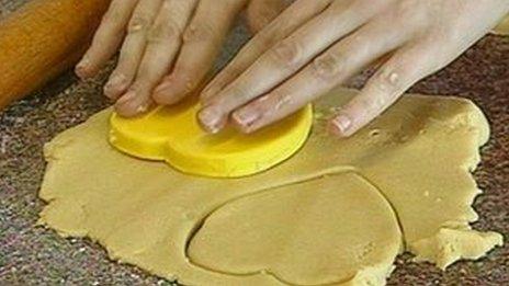 student cutting out pastry