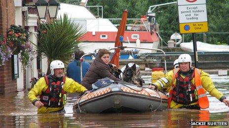 Claire Bunn and her dogs transported fro the flooded pub