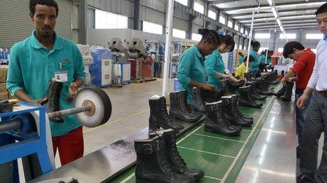 People working at an assembly line at the Huajian shoe factory in Dukem, Ethiopia